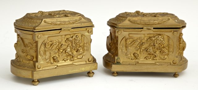 Pair of Lobed Gilt Spelter Ring Boxes. c. 1870, with re: Pair of Lobed Gilt Spelter Ring Boxes. c. 1870, with relief decoration of wolves, lions and artists' palettes, H.- 3 1/4 in., W.- 4 1/2 in., D.- 2 7/8 in.