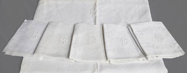 Group of Seven Vintage Linens, early 20th c., consistin: Group of Seven Vintage Linens, early 20th c., consisting of 6 napkins and a tablecloth, with floral decoration, each monogramed "B," Napkins, 31 1/2 in., x 27 in., tablecloth- app 66 in. x 97 in.