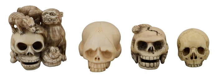 Group of Four Japanese Carved Skull Netsuke, Largest- H.- 1 3/4 in., W.- 1 3/4 in., D.- 1 1/2