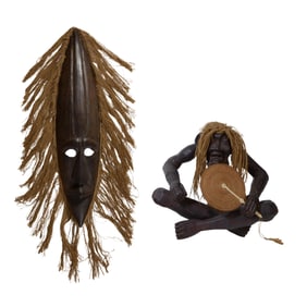 Two Indonesian Sculptures, 20th c., Mask- H.- 40 in., W.- 10 in., D.- 4 1/2 in.; Figure- H.- 18 in.,