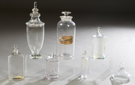 Group of Six Glass Apothecary Items, early 20th c., Arnica- H.- 14 7/8 in., Dia.- 5 1/2 in. (6 Pcs.)