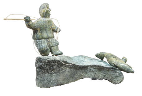 Eegeesiak Shoo (Inuit/Nunavut, 20th/21st Century), Carved Soapstone Seal Hunter, H.- 6 1/2 in., W.-: Eegeesiak Shoo (Inuit/Nunavut, 20th/21st Century), Carved Soapstone Seal Hunter, the balanced, polished soapstone hunter aiming a tethered spear at a polished seal figure, both atop a honed, naturalis