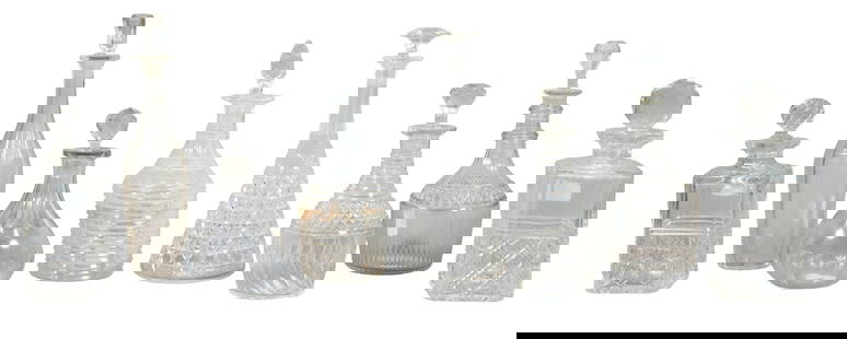 Group of Eight Cut Glass Decanters and Stoppers, late 19th/early 20th c., Tallest- H.- 12 1/2 in.,: Group of Eight Cut Glass Decanters and Stoppers, late 19th/early 20th c., consisting of two square examples; a bottle form example with etched grape decoration; two tall tapered cylindrical examples;