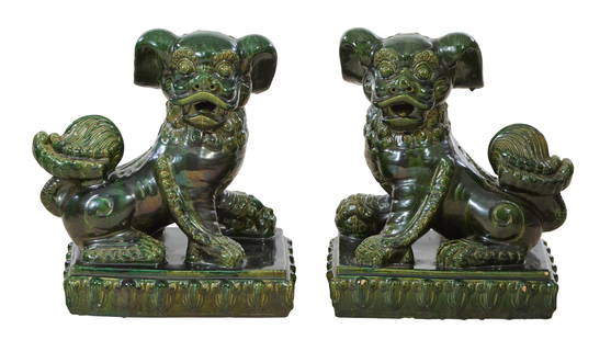 Pair of Large Chinese Ceramic Foo Dogs, 20th c., Each- H.- 24 in., W.- 21 1/2 in., D.- 14 1/2 in. (2: Pair of Large Chinese Ceramic Foo Dogs, 20th c., with opposing stances, in green glaze, on integral ceramic base, Each- H.- 24 in., W.- 21 1/2 in., D.- 14 1/2 in. (2 Pcs.) Provenance: Property from th