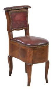 Unusual Leather Upholstered Walnut Bidet Chair, 19th c., H.- 33 1/2 in., W.-12 in., D.- 24 in.: Unusual Leather Upholstered Walnut Bidet Chair, 19th c., the lifting leather armrest opening to a compartmented interior, over a removable leather seat revealing a porcelain basin with floral decorati