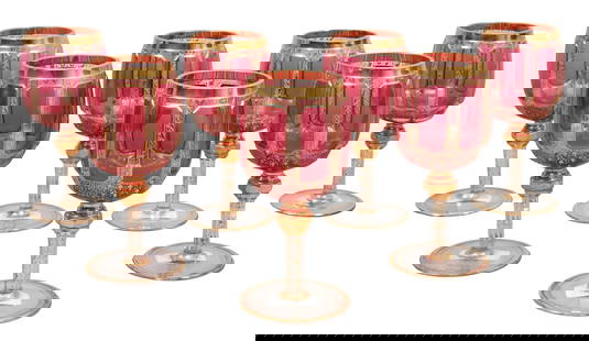 Group of Seven Bohemian Moser Style Pale Cranberry Crystal Goblets, early 20th c., Each- H.- 6 5/8: Group of Seven Bohemian Moser Style Pale Cranberry Crystal Goblets, early 20th c., with gilt decoration, Each- H.- 6 5/8 in., Dia.- 3 1/8 in. (7 Pcs.)