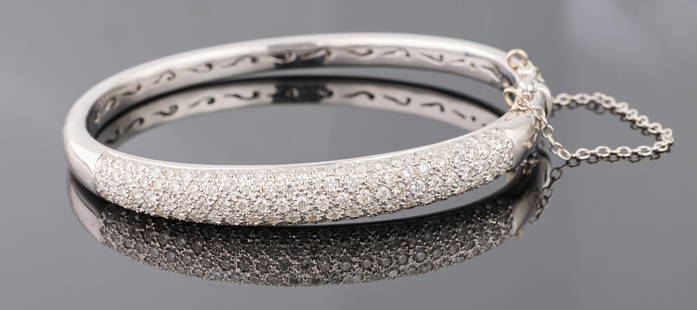 14K White Gold Diamond Bangle Bracelet, App. Total Wt.- .75 Troy oz., Int. H.- 1 7/8 in., Int. W.- 2: 14K White Gold Diamond Bangle Bracelet, with five rows of pave diamonds, with safety chain, App. Total Wt.- .75 Troy oz., Int. H.- 1 7/8 in., Int. W.- 2 1/4 in. Please Note: Proper forms of payment ac