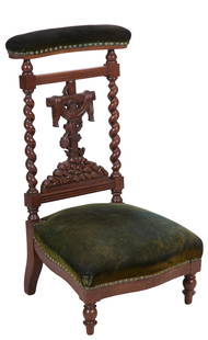 French Louis XIII Style Carved Walnut Prie Dieu, late 19th c., H.- 34 1/2 in., W.- 20 in., D.- 19: French Louis XIII Style Carved Walnut Prie Dieu, late 19th c., the shaped upholstered hand rest over draped vine covered cross on a rock cropping, barley twist stiles, serpentine kneeler, toupie