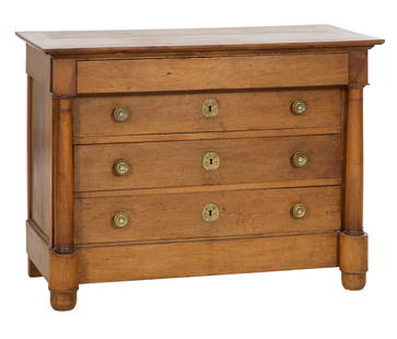 French Empire Style Walnut Commode, mid 19th c., H.- 35 in., W.- 47 1/2 in., D.- 23 in.: French Empire Style Walnut Commode, mid 19th c., the rectangular top with canted edge, over a projected frieze drawer and three lower drawers flanked by ring turned reverse tapered columnar stiles,