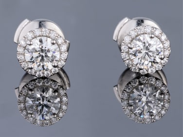 Pair of Tiffany & Co. Platinum Diamond Halo Stud Earrings, Total Diamond Wt.- 0.97 carats