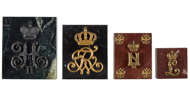 Four Monarchs' Brass Cyphers, 20th c., Largest- H.- 1 in., W.- 3 1/2 in., D.- 4 in. (4 Pcs.)