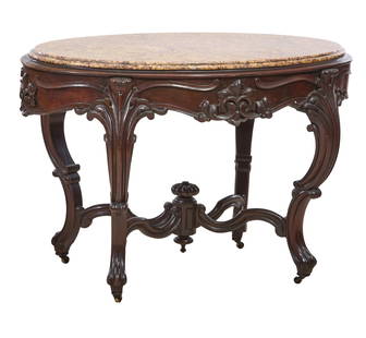 American Rococo Revival Marble Top Carved Walnut Center Table, mid to late 19th c., H.- 31 1/2 in.,: American Rococo Revival Marble Top Carved Walnut Center Table, mid to late 19th c., the inset variegated moulded marble top over deep carved apron with foliate scrolls, on heavy acanthus carved 'C' sc
