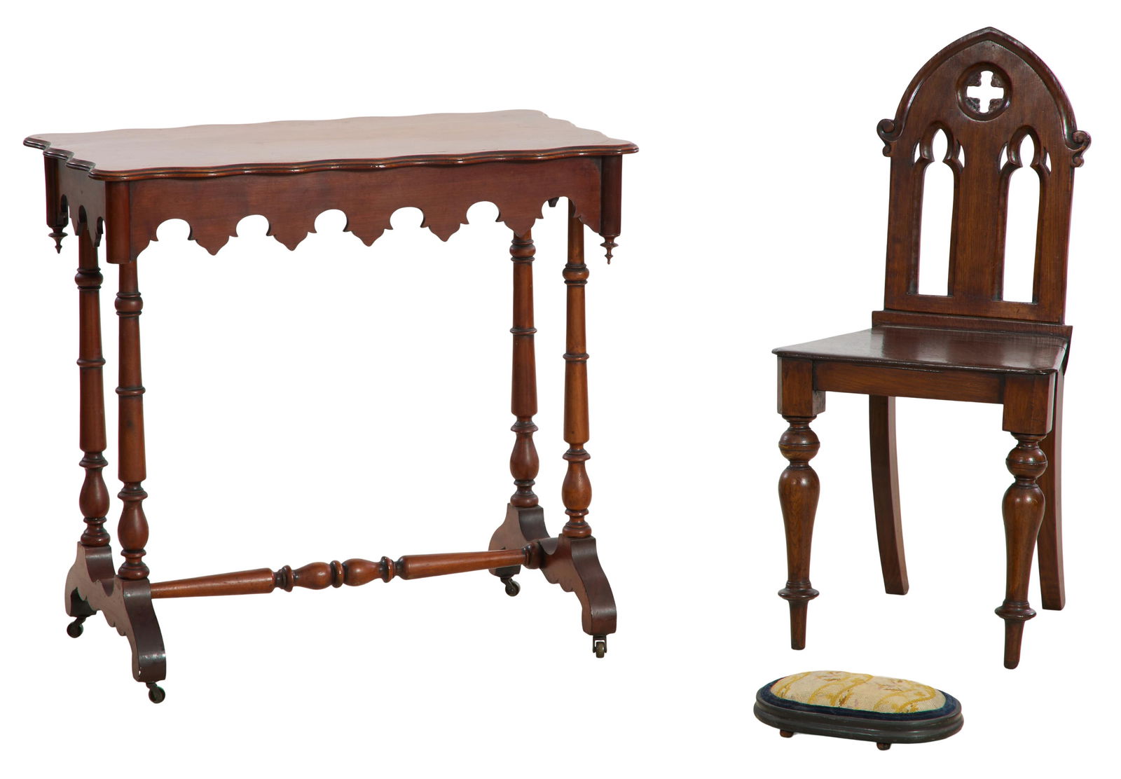 English Gothic Side Chair and Gothic Trestle Table, mid 19th c., Table- H.- 29 1/2 in., W.- 31 1/2: English Gothic Side Chair and Gothic Trestle Table, mid 19th c., the chair with pierced gothic arched back, plank seat, on ring turned bulbous legs; the table with a molded shaped edge, over a scallop