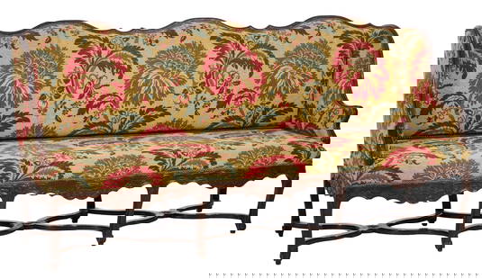 Large French Louis XIV Style Carved Walnut Canape, early 19th c., H.- 41 in., W.- 83 1/2 in., D.- 28: Large French Louis XIV Style Carved Walnut Canape, early 19th c., the triple arched spurred backs with winged sides into moulded arms, scroll and foliate seat rail with carved knee and scrolling foot