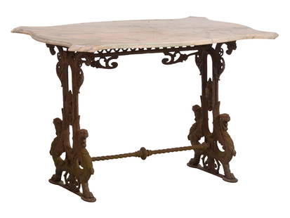 American Cast Iron Marble Top Garden Table, mid 19th c., H.- 27 3/4 in., W.- 42 in., D.- 30 in.: American Cast Iron Marble Top Garden Table, mid 19th c., the turtle top moulded edge marble top over a scrolling iron trestle base with a central mask, and griffin form legs joined by turned rope twis
