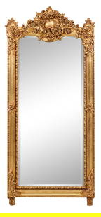 Rococo Inspired Carved Gilt and Gesso Mirror, 21st c., H.-69 in., W.- 30 in.: Rococo Inspired Carved Gilt and Gesso Mirror, 21st c., the rocaille crest and corners, beaded outer surround, moulded frame, leaf and dot inner liner, raised on feet, H.-69 in., W.- 30 in.
