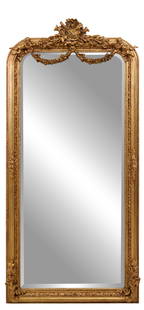 Louis XV Inspired Giltwood Figural Overmantel Mirror, 21st c., H.- 83 in., W.- 39 in.: Louis XV Inspired Giltwood Figural Overmantel Mirror, 21st c., the central wreath crest with music trophy over swags held by putti, arched top corners, foliate carved surround with floral and