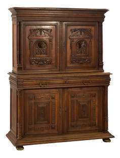 French Renaissance Revival Carved Walnut Buffet a Deux Corps, 19th c., H.- 75 in., W.- 56 in., D.-: French Renaissance Revival Carved Walnut Buffet a Deux Corps, 19th c., the superstructure with stepped moulded cornice over two doors featuring poet bust carvings with architectonic surround, flanked
