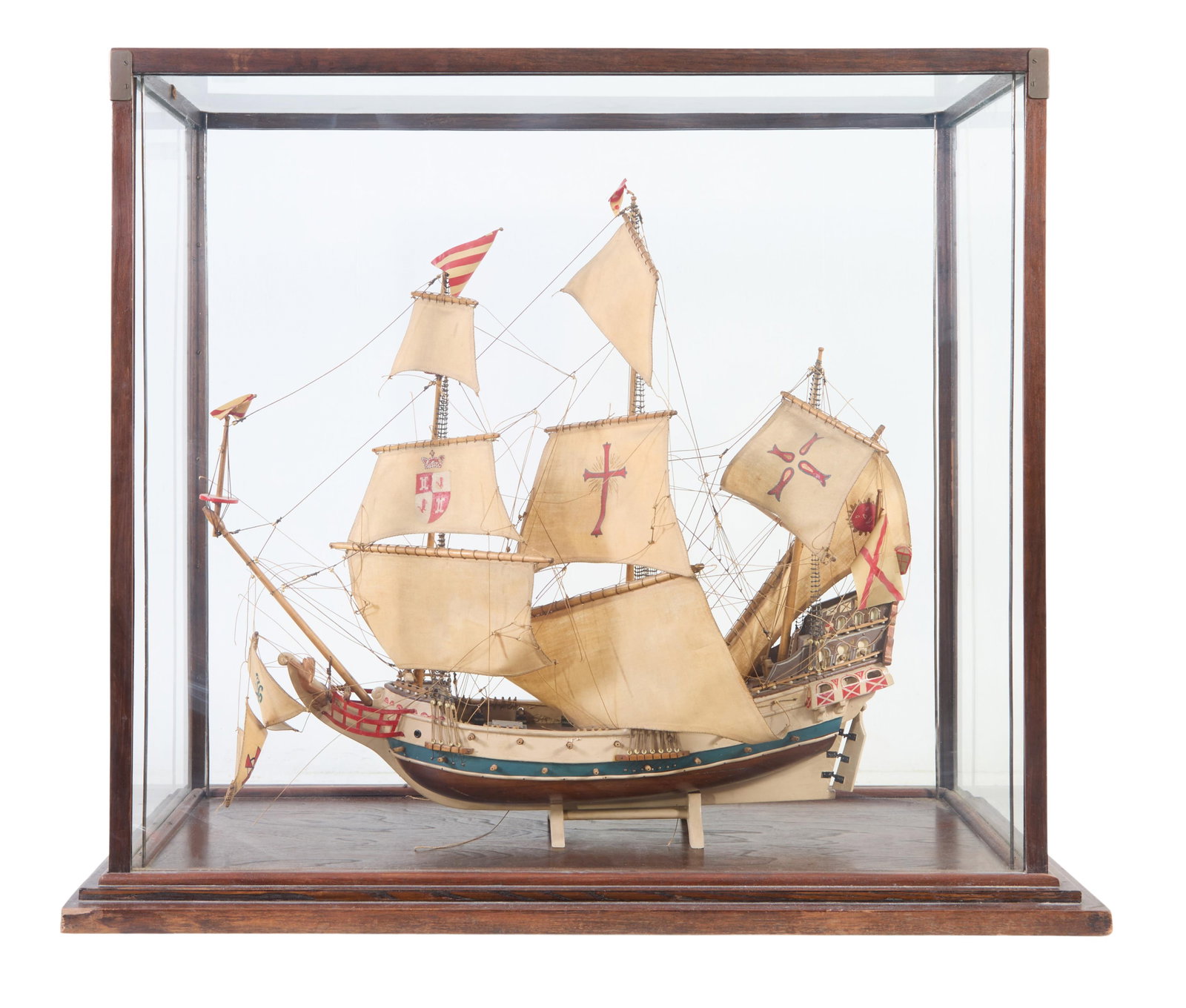 Spanish Galleon Ship Model in Case, 20th c., Case- H.- 31 in., W.- 36 in., D.- 17 in.: Spanish Galleon Ship Model in Case, 20th c., the polychromed ship with well rigged sails and flags, on a stand, in a glazed hard wood case, Case- H.- 31 in., W.- 36 in., D.- 17 in.