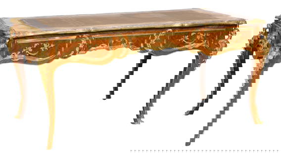French Louis XV Style Ormolu Mounted Parquetry Desk, 20th c., H.- 33 in., W.- 71 in., D.- 36 in.: French Louis XV Style Ormolu Mounted Parquetry Desk, 20th c., the inset leather writing surface with foliated shaped brass banding, three drawers, figural mounted knees, cabriole legs, sabot, H.- 33 i