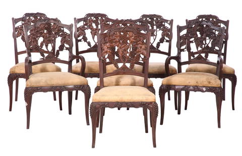 Eight French Art Nouveau Carved Walnut 'Grapevine' Dining Chairs, early 20th c., Each- H.- 38 in.,: Eight French Art Nouveau Carved Walnut 'Grapevine' Dining Chairs, early 20th c., including two arm chairs and six side chairs, the arched backs with pierced dimensional carved grape cluster, vine and
