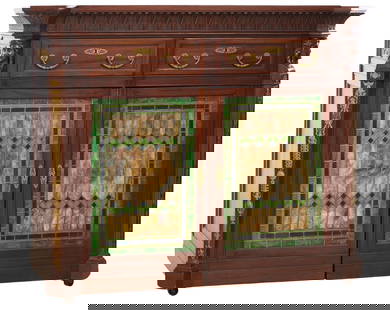 American Egyptian Revival Ormolu Mounted Stained Glass Carved Mahogany Banker's Secretary, late 19th: American Egyptian Revival Ormolu Mounted Stained Glass Carved Mahogany Banker's Secretary, late 19th c., the hinged acanthus lapped coved carved top stacks back to reveal a desk surface with six cubbi
