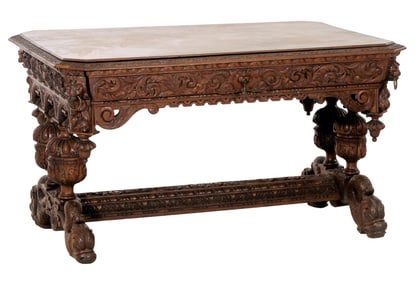 Continental Renaissance Revival Carved Oak Library Table, late 19th c., H.- 30 in., W.- 56 in., D.-