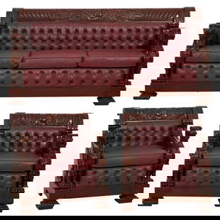 Three Piece American Renaissance Leather and Carved Walnut Seating Group, Style of R.J. Horner, 20th: Three Piece American Renaissance Leather and Carved Walnut Seating Group, Style of R.J. Horner, 20th c., consisting of a sofa and two arm chairs, scrolled back crest rails with central cabochon shield