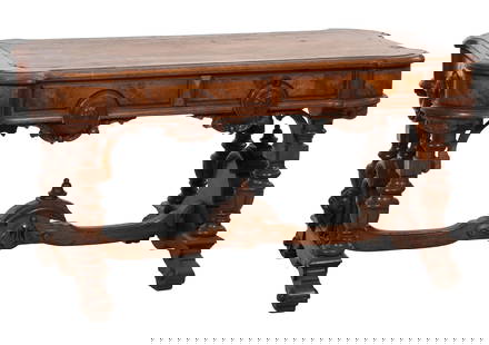American Renaissance Revival Black Walnut Library Table, late 19th c., H.- 28 in., W.- 53 in., D.-: American Renaissance Revival Black Walnut Library Table, late 19th c., the shaped moulded top with inset leather writing surface, four drawers with maiden bust cartouche, the finialed stretchered span