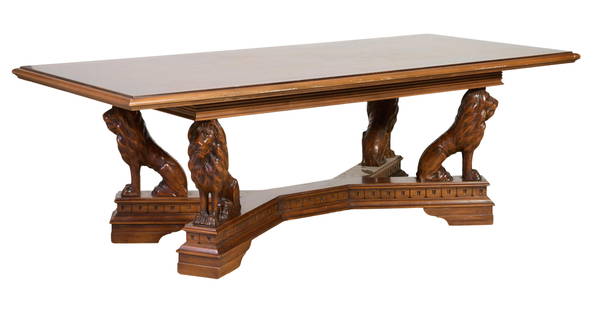 Lion Base Carved Walnut Library Table, 20th c., H.- 30 1/2 in., W.- 90 in., D.- 41 1/2 in.: Lion Base Carved Walnut Library Table, 20th c., the moulded rectangular top over stepped frieze, four lions seated on an extended 'X' stretcher, on bracket feet, H.- 30 1/2 in., W.- 90 in., D.- 41 1/2