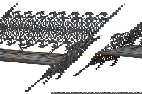 Ornate Double Sided Wrought Iron Park Bench, 20th c., H.- 48 in., W.- 77 in., D.- 34 1/2 in.: Ornate Double Sided Wrought Iron Park Bench, 20th c., the pierced back with running arches, high finialed sides into double sided handrails, pierced foliate standards on hoof feet, iron slat seat, H.-