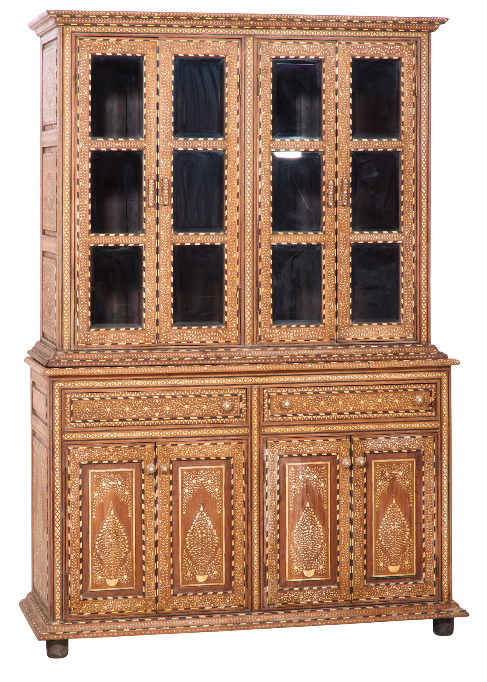 Indian Inlaid Bone and Mixed Wood Bookcase, 20th c., H.- 89 1/2 in., W.- 62 in., D.- 24 in.: Indian Inlaid Bone and Mixed Wood Bookcase, 20th c., the cornice with foliate and barber inlay, four glazed doors with vining inlay, shelved interior, base with conforming inlay with two drawers over