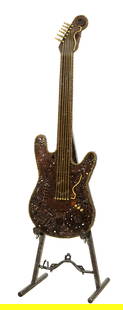 Large Contemporary Metal Guitar Sculpture, 21st C., designed by Kalifano, Overall- H.- 86 in., W.-: Large Contemporary Metal Guitar Sculpture, 21st C., designed by Kalifano, patinated assemblage of recycled auto parts, on a conforming easel made of industrial metal pipes, unsigned, Overall- H.- 86 i