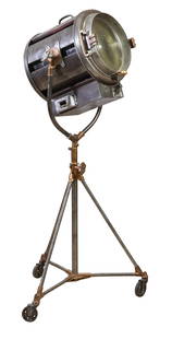 Large Metal and Brass Mole Richardson Co. Rolling Movie Spot Light, Hollywood, CA, 20th c., H.- 70: Large Metal and Brass Mole Richardson Co. Rolling Movie Spot Light, Hollywood, CA, 20th c., the directional lensed fixture over a tripartite base on casters, H.- 70 in., W.- 34 in., D.- 34 in.