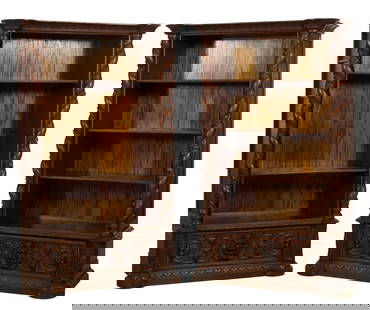 Pair of Italian Style Carved Walnut Bookcases, 20th c., Each- H.- 79 1/2 in., W.- 45 in., D.- 22 in.: Pair of Italian Style Carved Walnut Bookcases, 20th c., the moulded cornice with turret corners, leaf and berry barley twist columnar stiles, open shelves, lower base drawer with central zoomorphic ma