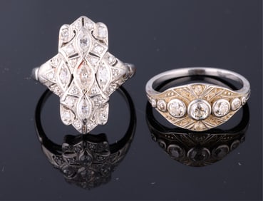 Two Platinum and Diamond Rings, App. Wt.- 9.4 grams; Each- Size- 6.