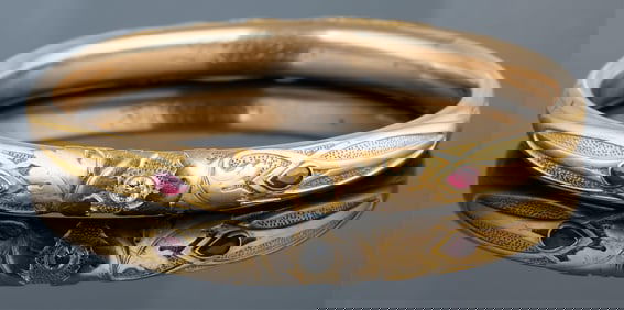 14K Yellow Gold Diamond and Ruby Bangle, App. Wt.- 18.9 grams; Int. H.- 2 1/4 in., Int. W.- 2 1/2