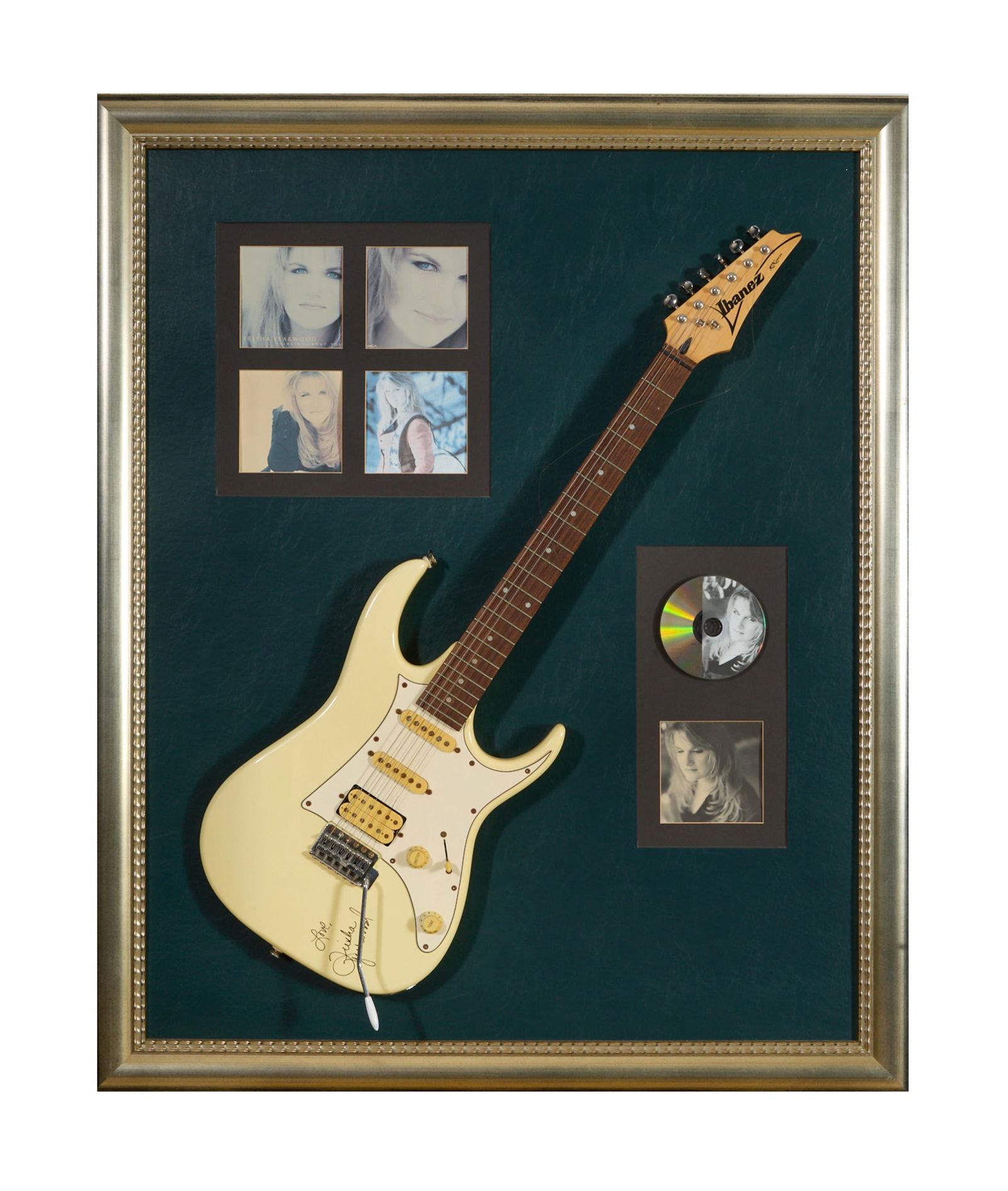 Trisha Yearwood Autographed Ibanez Electric Guitar and Memorabilia, Overall- H.- 45 in., W.- 36 1/2: Trisha Yearwood Autographed Ibanez Electric Guitar and Memorabilia, the guitar sharpie signed and inscribed "Love" on the body, presented with an MCA Records "Thinkin' About You" CD and reproduced CD
