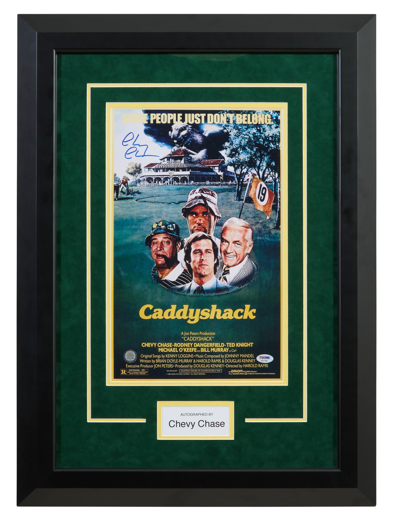 "Caddyshack" (1980) Autographed Memorabilia by Chevy Chase, Overall- H.- 29 1/4 in., W.- 20 1/4 in.: "Caddyshack" (1980) Autographed Memorabilia by Chevy Chase, with reduced facsimile of the film poster, signed in print, presented with a white plaque in a black frame with plexiglass, Overall- H.- 29