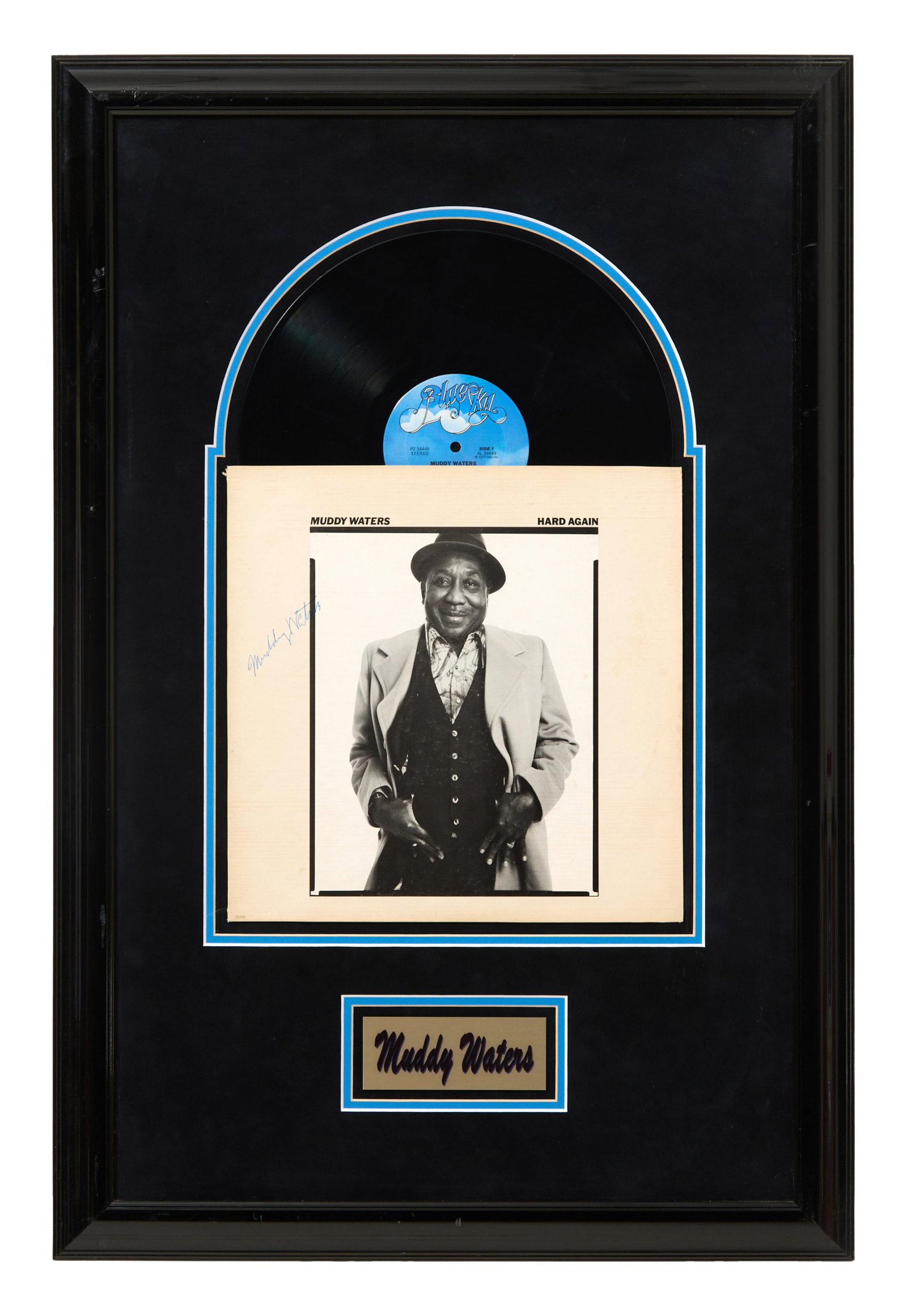Muddy Waters "Hard Again" Autographed Album Memorabilia, Framed- H.- 33 in., W.- 22 in.: Muddy Waters "Hard Again" Autographed Album Memorabilia, with Blue Sky Records LP and signed album cover, with gilt plaque and handwritten description from MGM Collectables on reverse, matted and pres
