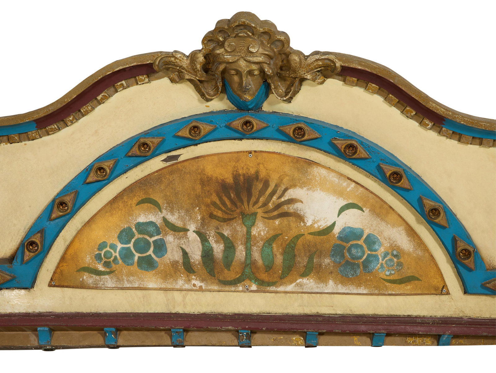 Architectural Carousel Entablature Segment, late 19th/early 20th c., H.- 42 in., W.- 98 in., D.- 6: Architectural Carousel Entablature Segment, late 19th/early 20th c., of slightly bowed form, maiden mask flanked by dentilated scroll, arched section with light sockets, stenciled floral design, H.- 4