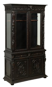 American Renaissance Style Carved Wood Gun Cabinet, 20th c., H.- 97 in., W.- 52 in., D.- 20 in.