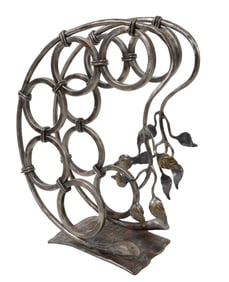 Daniel Boone Iron Wine Rack, 20th c., H.- 19 in., W.- 16 in., D.- 8 in.