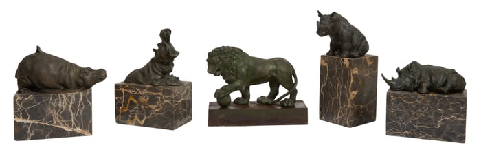 Four Bronze Animals on Marble Bases, together with a Cast Iron Lion on Plinth, early 20th c., Taller
