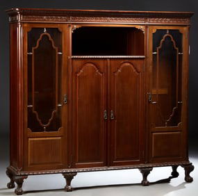 English Chippendale Style Carved Mahogany Bookcase, 20th c., H.- 76 in., W.- 84 in., D.- 18 in.