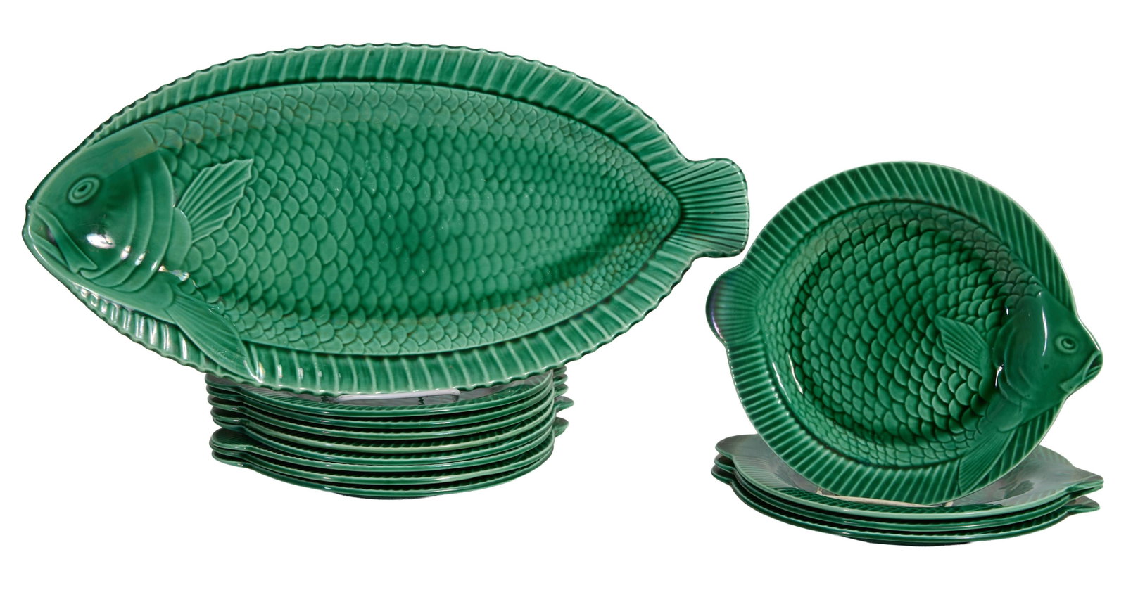 Thirteen Piece French Majolica Flounder Fish Service, 20th c., Platter- W.- 20 3/4 in., D.- 10 in.;: Thirteen Piece French Majolica Flounder Fish Service, 20th c., including a platter and twelve plates, the scaled oblong flounder form platter with conforming round fish service plates, Platter- W.- 20