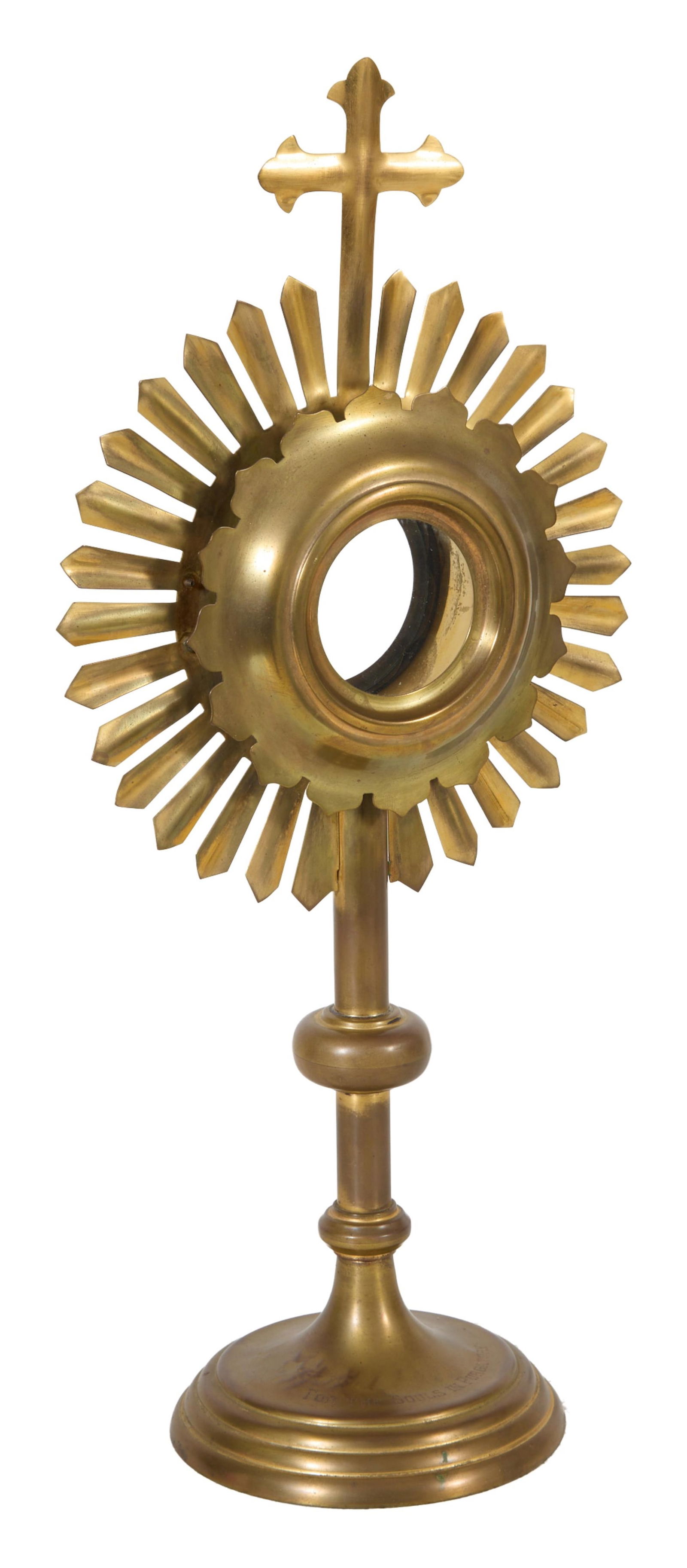 Brass Monstrance, 19th c., H.- 18 7/8 in., W.- 8 1/4 in., D.- 5 1/2 in.: Brass Monstrance, 19th c., of sunburst form, topped with a cross, the stepped base engraved "For the Souls in Purgatory," with two glass mounted windows, H.- 18 7/8 in., W.- 8 1/4 in., D.- 5 1/2 in. P
