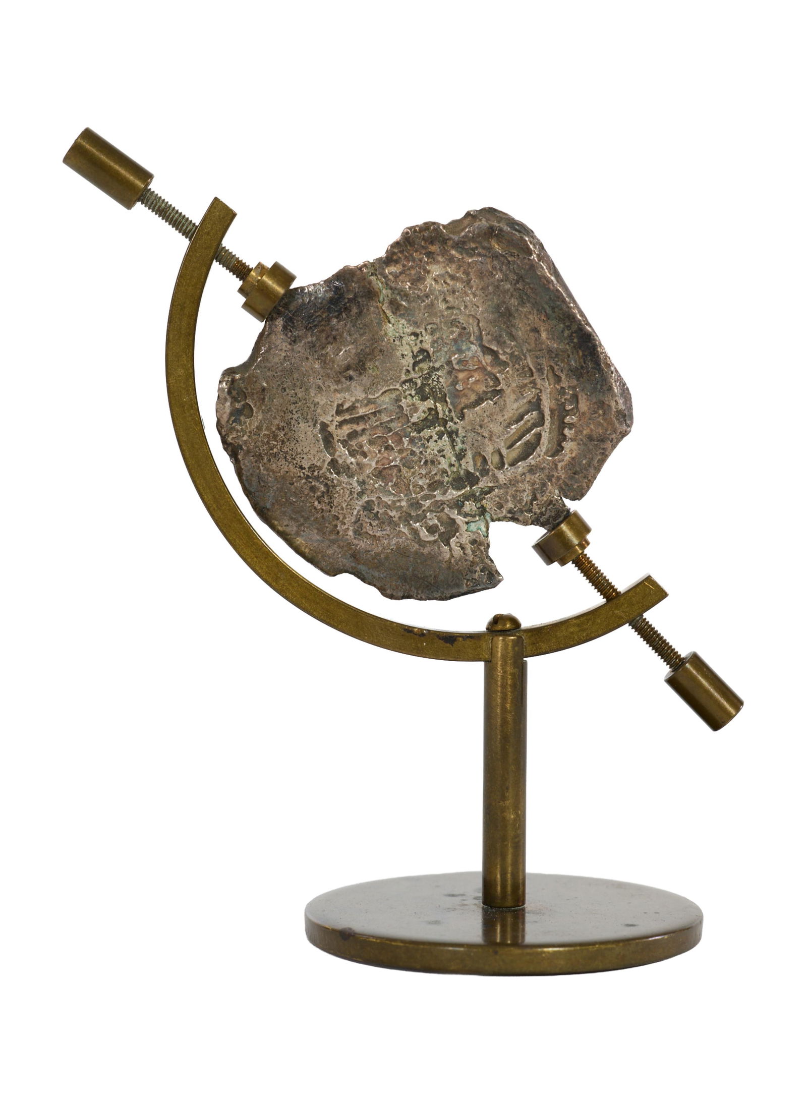 Spanish Atocha 8 Reales Cob Silver Coin, 18th c., H.- 3 3/8 in., W.- 3 1/8 in., D.- 3 in.: Spanish Atocha 8 Reales Cob Silver Coin, 18th c., on brass presentation stand, H.- 3 3/8 in., W.- 3 1/8 in., D.- 3 in. Other Notes: This piece has been analyzed with handheld WRF tester gun by an inde