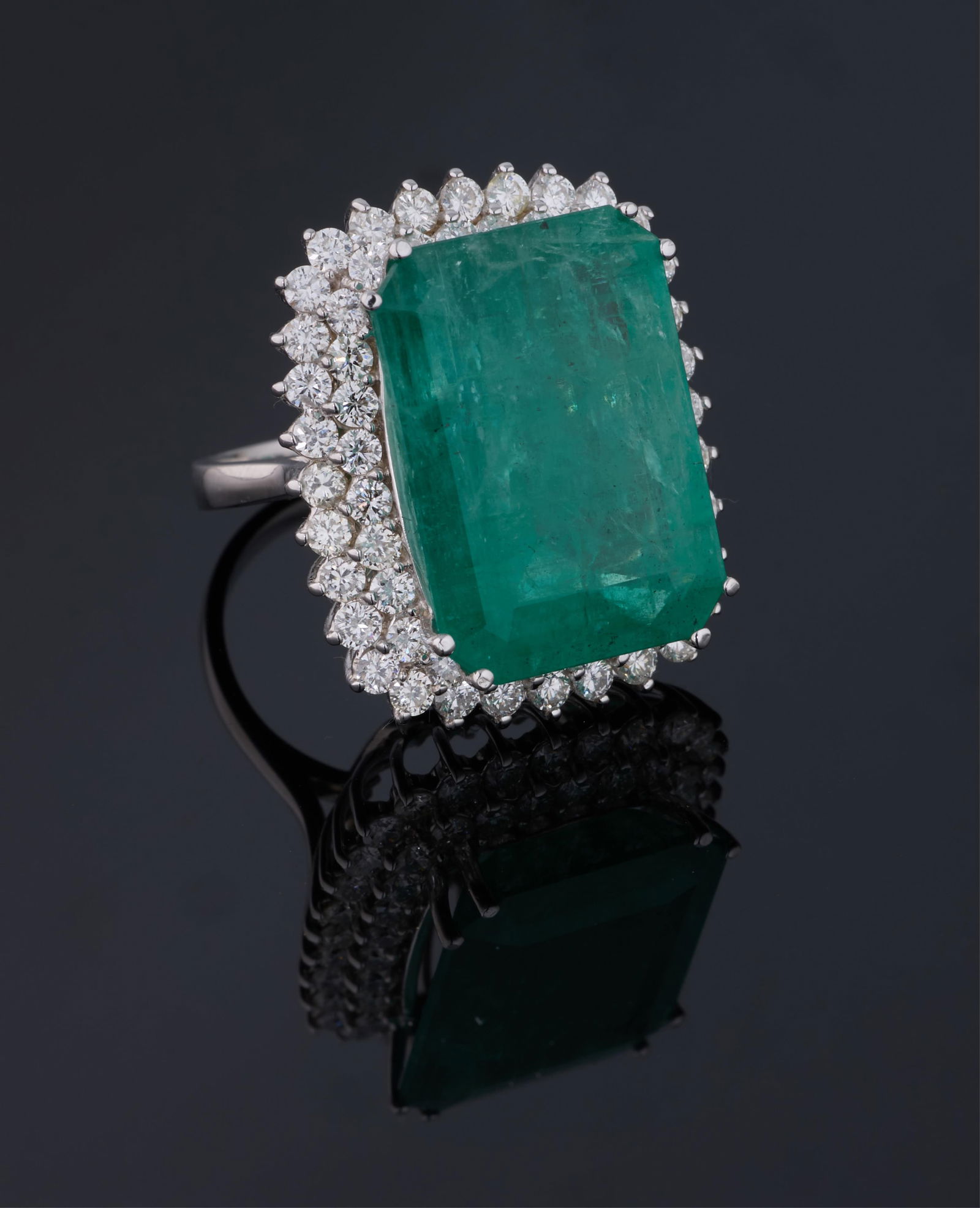 Ladies' 14K White Gold Emerald and Diamond Dinner Ring, Total Diamond Wt.- 2.75 carats, Size- 6 3/4,: Ladies' 14K White Gold Emerald and Diamond Dinner Ring, the center mounted 19.12 carat emerald atop a double conforming concentric border of small round white diamonds, Total Diamond Wt.- 2.75 carats,