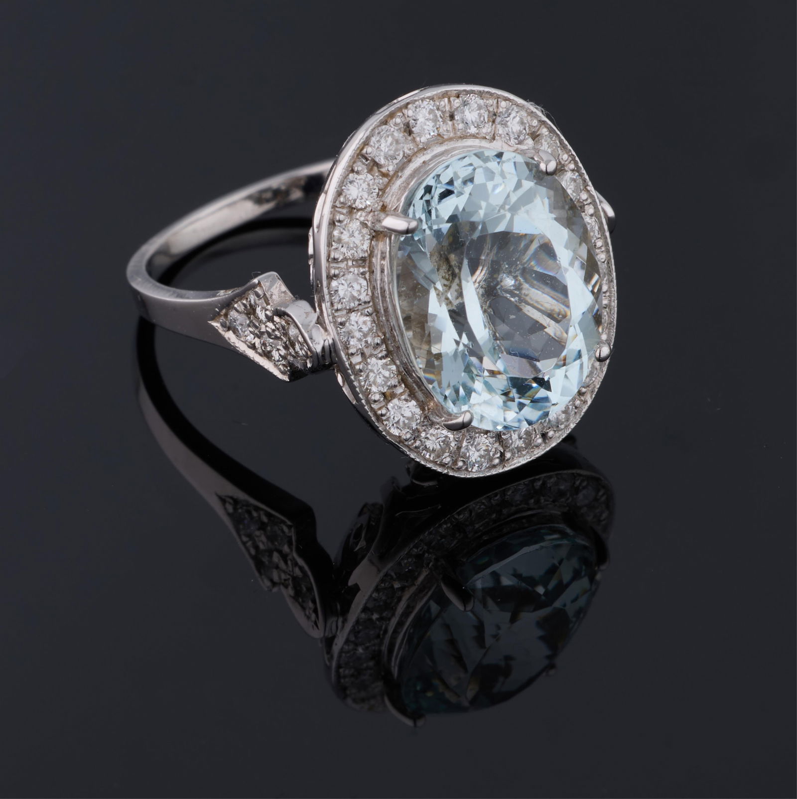14K White Gold Aquamarine and Diamond Ring, Total Diamond Wt.- 1.65 carats, Size- 7 1/4, with AIGL: 14K White Gold Aquamarine and Diamond Ring, the center mounted 7.00 carat oval aquamarine atop a conforming border mounted with small round white diamonds, and four small round white diamonds mounted